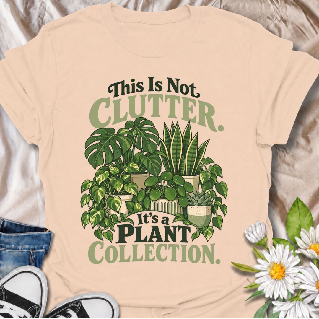 A funny houseplant T-shirt for anyone who insists their ever-growing greenery is a collection, not clutter. The phrase “This Is Not Clutter. It’s a Plant Collection.” pairs with a lush group of monstera, snake plants, pothos, pilea, and succulents for an instantly recognizable plant-lover design. It is perfect for plant parents, indoor gardeners, and houseplant collectors whose shelves and surfaces have slowly disappeared beneath pots. The bold botanical artwork keeps the design colorful, niche, and easy to