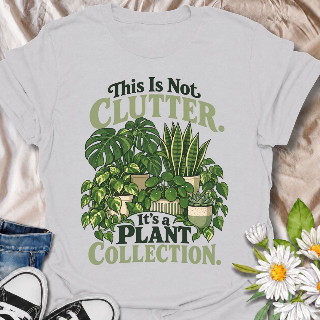 A funny houseplant T-shirt for anyone who insists their ever-growing greenery is a collection, not clutter. The phrase “This Is Not Clutter. It’s a Plant Collection.” pairs with a lush group of monstera, snake plants, pothos, pilea, and succulents for an instantly recognizable plant-lover design. It is perfect for plant parents, indoor gardeners, and houseplant collectors whose shelves and surfaces have slowly disappeared beneath pots. The bold botanical artwork keeps the design colorful, niche, and easy to