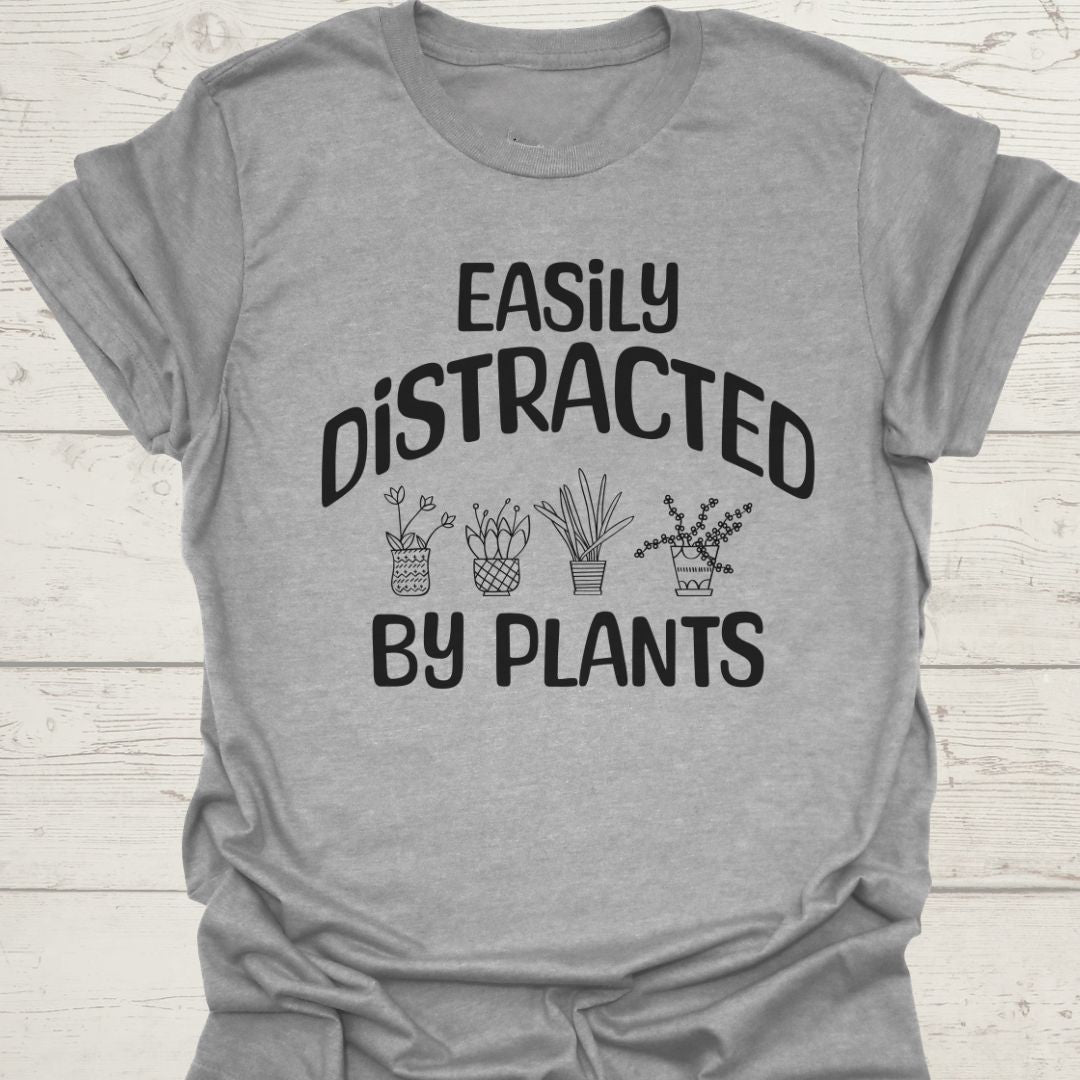 Easily Distracted By Plants in black Text with image of four small pot plants, all in black. This is on a sport grey T-shirt