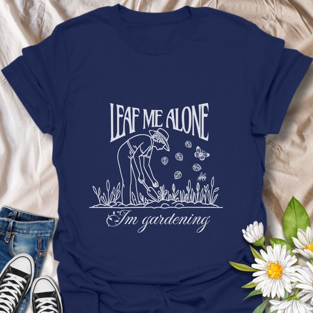 Perfect for plant lovers with a sense of humor! This "Leaf Me Alone I’m Gardening" t-shirt features a playful gardening pun with a simple, charming line art design. Great gift for gardeners who enjoy their peaceful time outdoors.