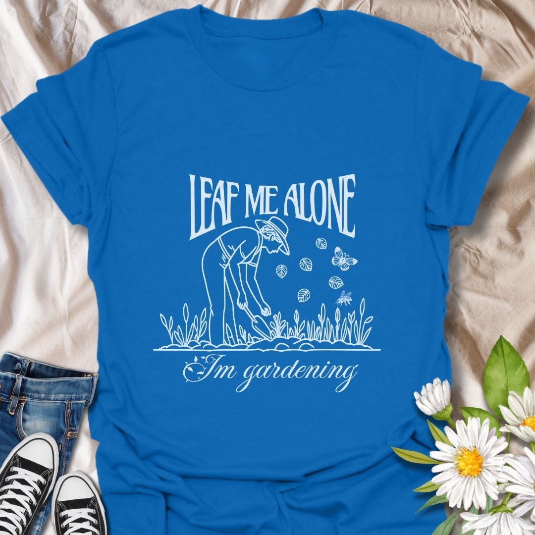 Perfect for plant lovers with a sense of humor! This "Leaf Me Alone I’m Gardening" t-shirt features a playful gardening pun with a simple, charming line art design. Great gift for gardeners who enjoy their peaceful time outdoors.