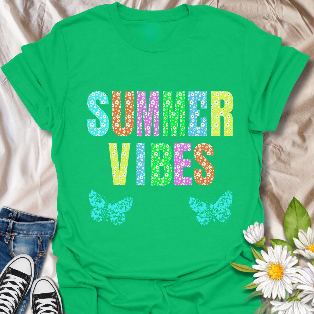 Bright and colorful "Summer Vibes" t-shirt with bold floral letters and butterfly accents. Perfect summer fashion for beach trips, vacations, festivals, or casual days. Ideal gift for anyone who loves sunshine, flowers, and vibrant summer style.