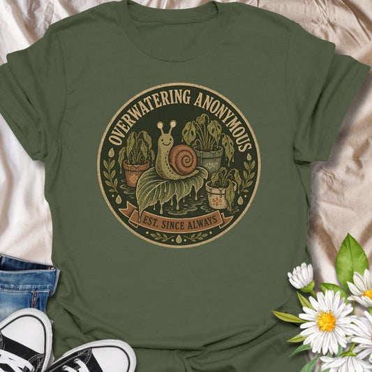 This Overwatering Anonymous t-shirt is made for plant lovers who mean well, even when their houseplants are definitely getting too much attention. Featuring a vintage-style badge design with a cute snail, sad potted plants, leafy details, water drops, and the phrase Est. Since Always, this design has a funny plant-parent feel with a dark botanical twist. Perfect for plant moms, plant dads, houseplant collectors, indoor gardeners, propagation fans, and anyone who has ever loved a plant a little too much with