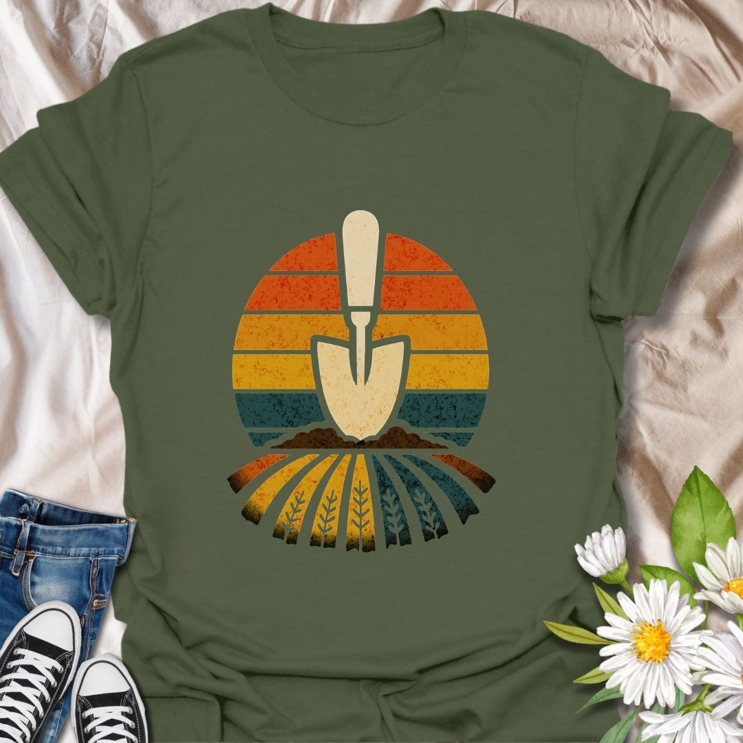 Retro gardening t-shirt featuring a vintage-style trowel and sunset field design. Perfect gift for gardeners, farmers, and nature lovers. Bold and earthy outdoor wear.