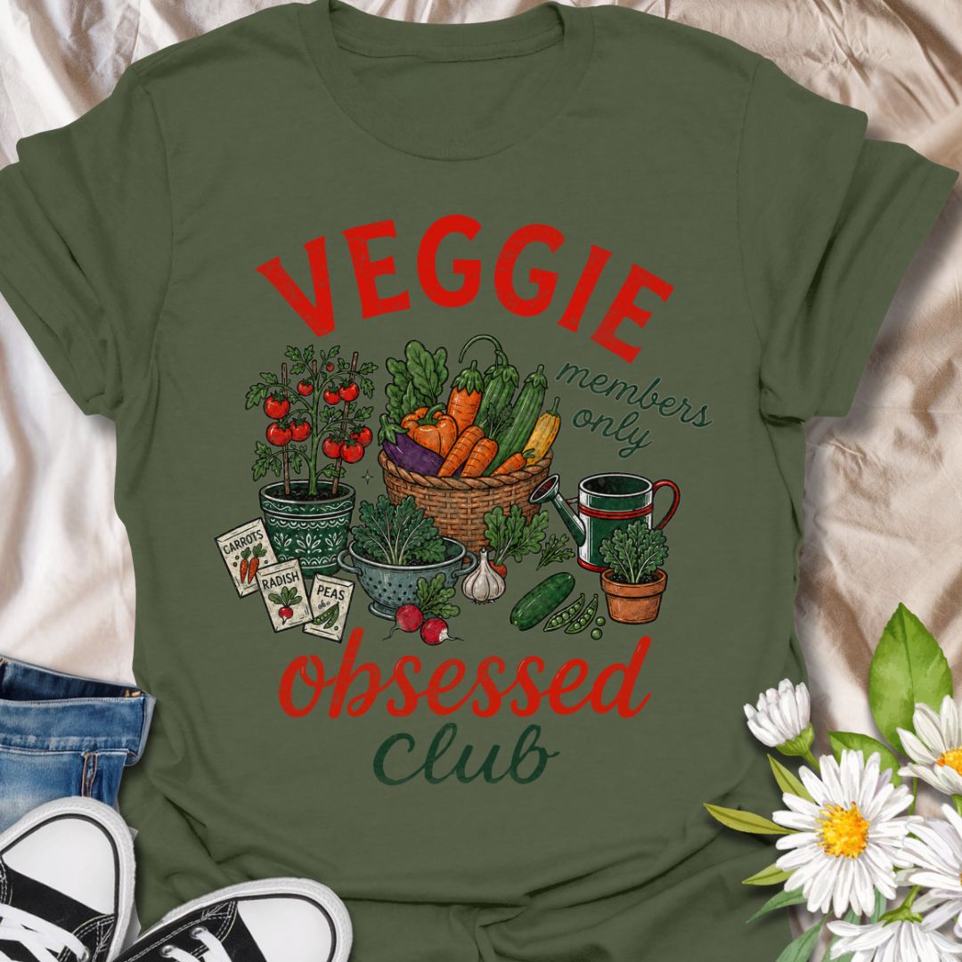 This Veggie Obsessed Club t-shirt is perfect for gardeners, vegetable lovers, and homegrown food fans. Featuring a colorful illustrated harvest scene with tomatoes, carrots, cucumbers, seed packets, and a watering can, this fun gardening tee is great for anyone who loves growing their own food and spending time in the garden.