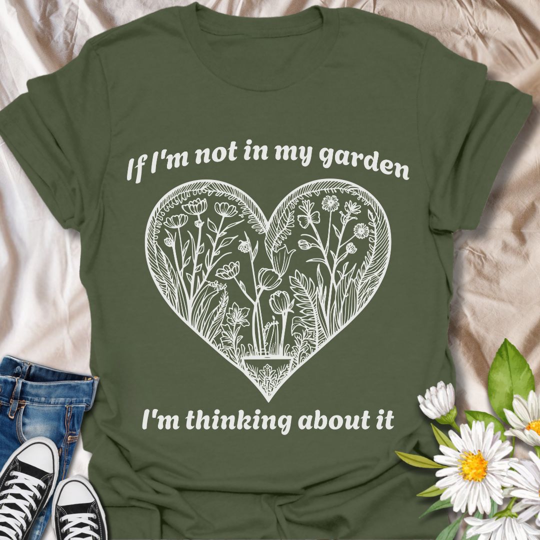 Show off your gardening passion with this beautifully illustrated heart-shaped floral design. Featuring the phrase “If I'm not in my garden, I'm thinking about it,” this shirt is perfect for plant lovers who dream of dirt, blooms, and backyard bliss.