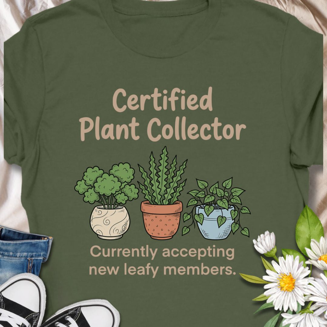 Show off your green thumb with this “Certified Plant Collector” t-shirt featuring charming potted plants and the phrase “Currently accepting new leafy members.” Perfect for plant parents, indoor jungle enthusiasts, or anyone who can’t resist bringing home another plant. A cozy and fun gift for birthdays or plant swaps.