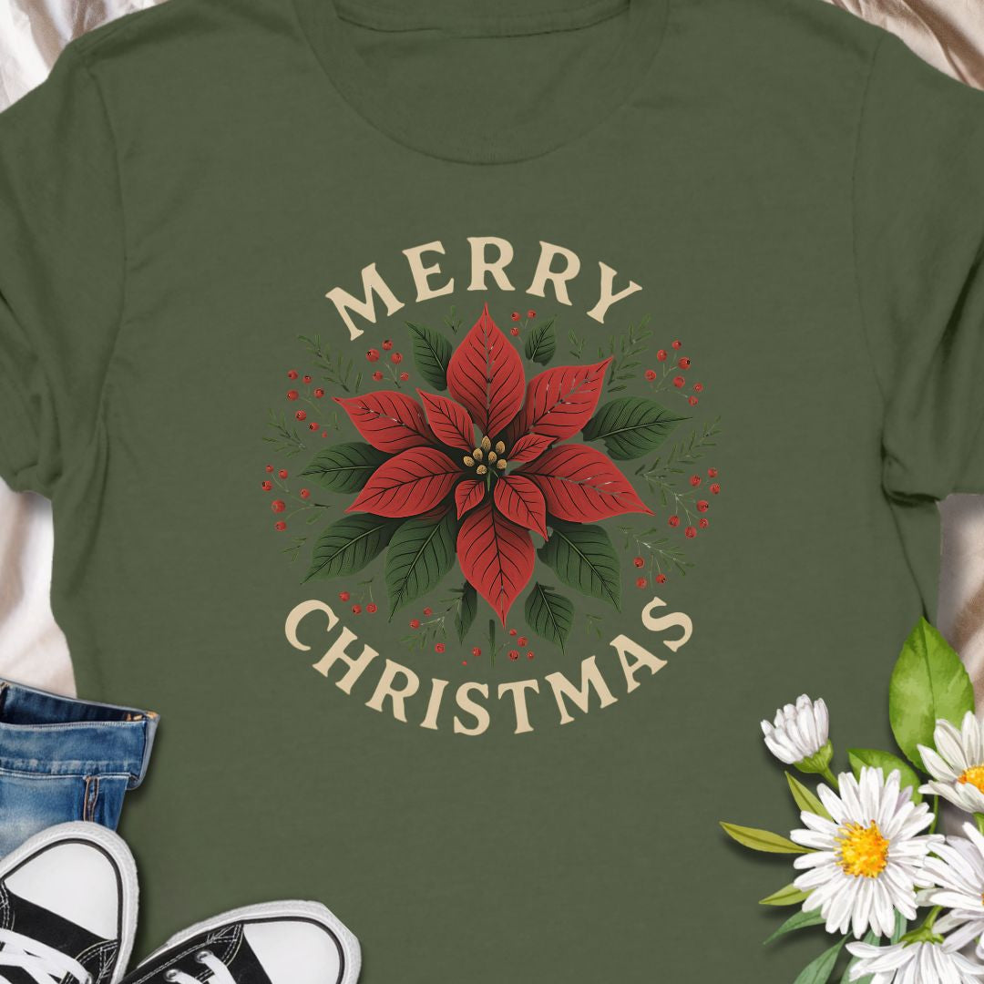 Botanical tee that carries a quietly festive spirit — a poinsettia framed by warm "Merry Christmas" lettering.  Subtle vintage tones in the print give the design a homey, handmade feel that blends with cozy kitchens, neighborhood caroling, and quiet evenings by twinkling lights. Wear it while wrapping gifts, making cocoa, or hosting a laid-back family dinner