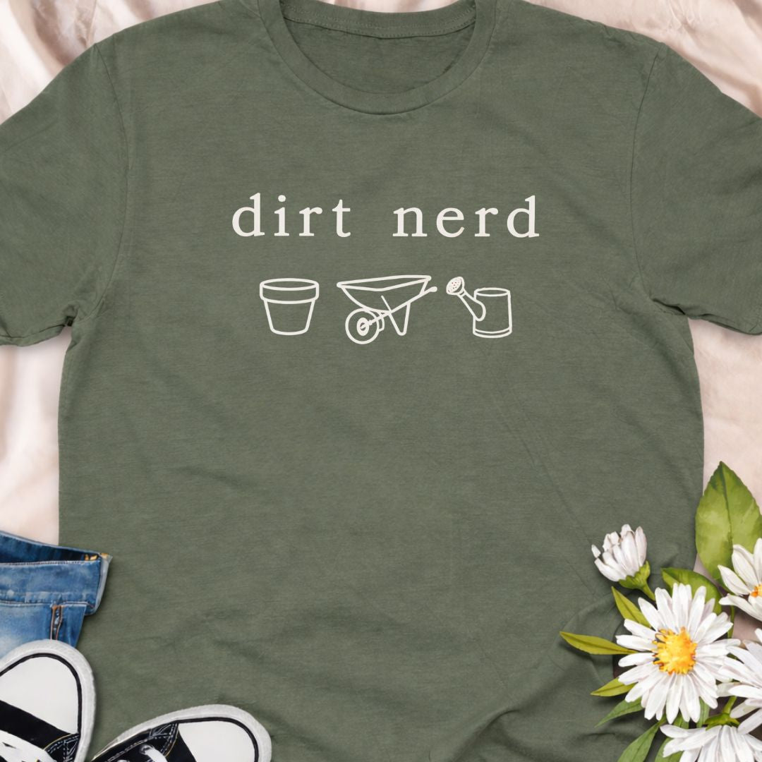 “Dirt Nerd” minimalist gardening t-shirt for plant lovers and gardeners. Subtle botanical humour tee featuring simple garden icons. Perfect for plant parents, garden enthusiasts, and anyone proudly obsessed with soil, plants, and growing things. A great gift for gardeners and plant nerds.