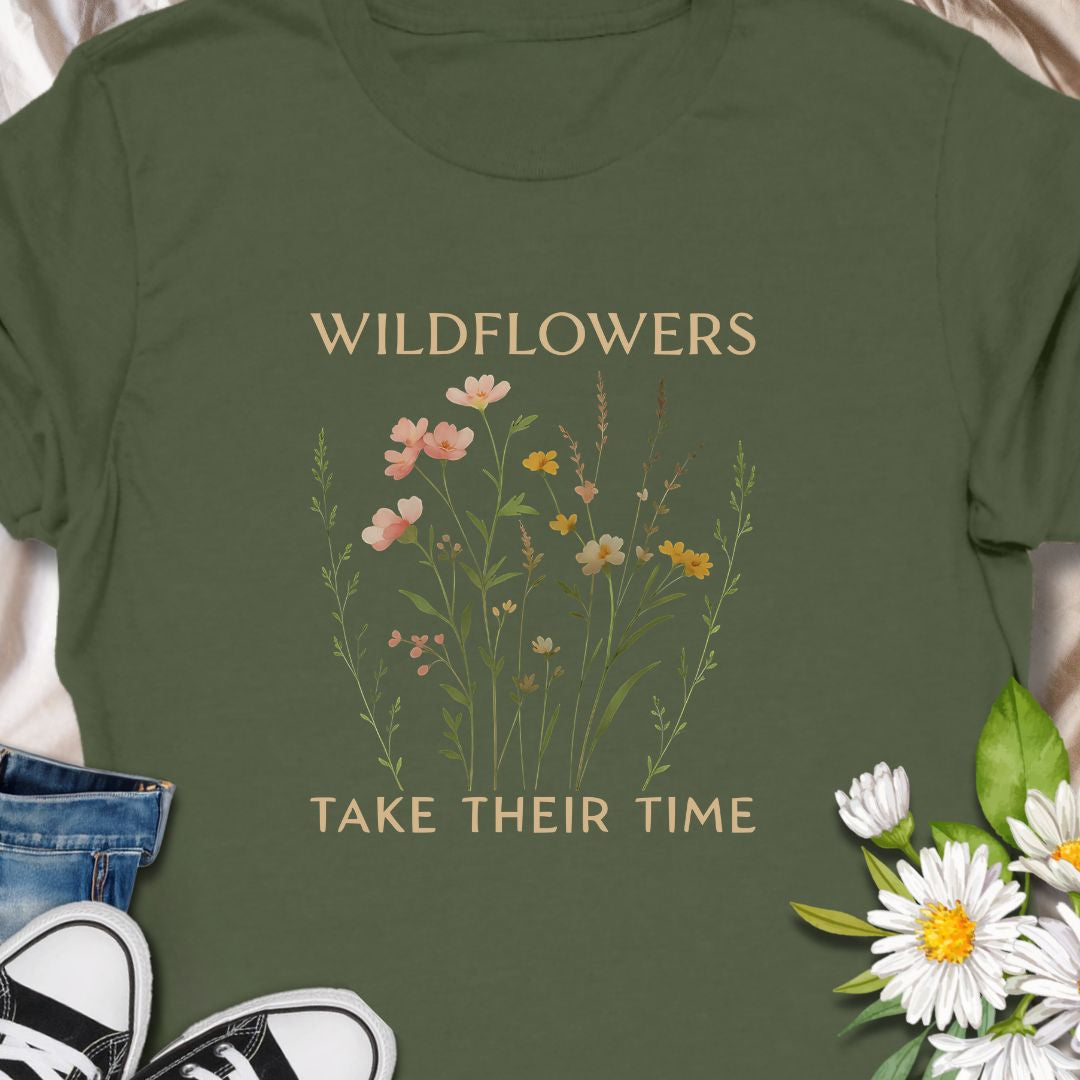 Inspirational wildflower tee featuring soft meadow flowers and motivational quote. A calming nature-themed shirt.