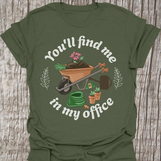 circular text 'You'll find me in my office' with wheelbarrow, hose, plants and watering can within circle all text in white on Military green t-shirt