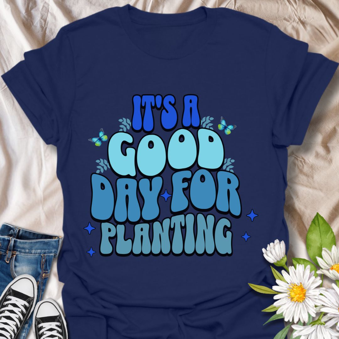 Bright and cheerful "It's a Good Day for Planting" t-shirt featuring retro-style typography with playful butterflies and vibrant blue tones. Perfect for gardeners, plant lovers, and anyone who finds joy in planting flowers and tending to nature. This planting t-shirt is an Ideal gardening gift, outdoor hobby shirt, botanical fashion, nature lover apparel, and springtime outfit.  