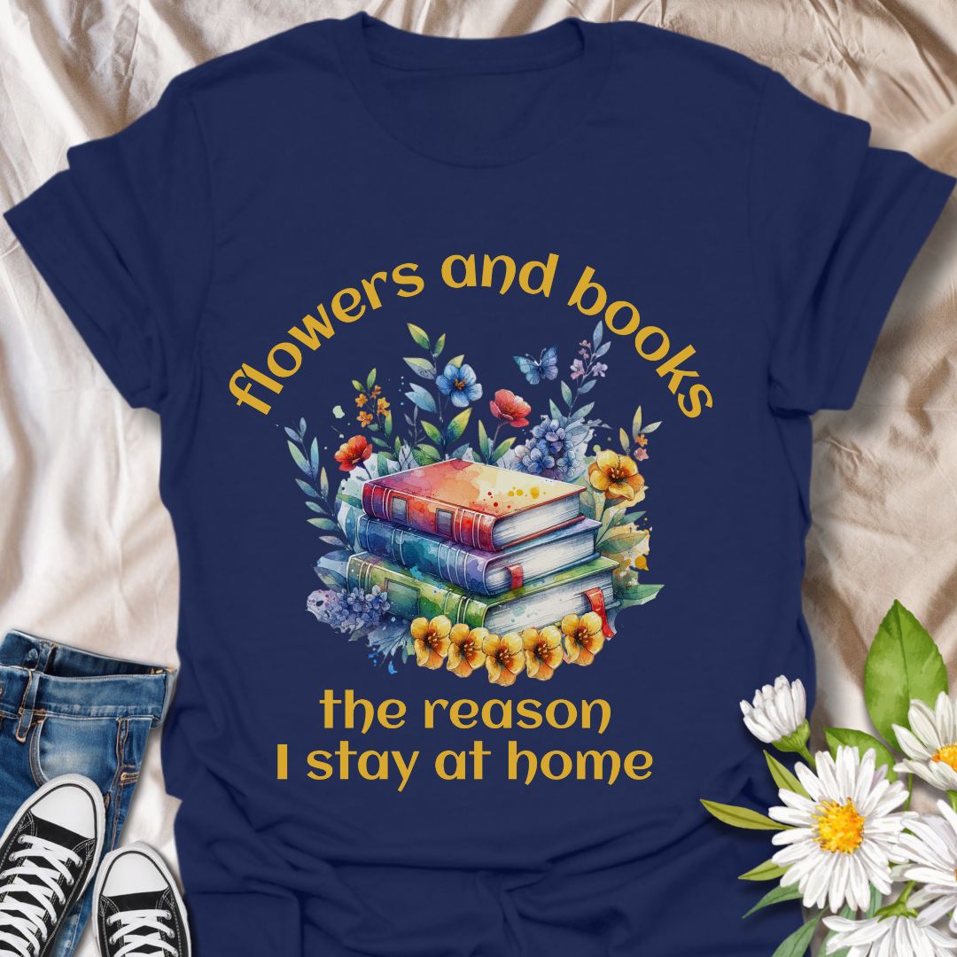 Bookworms and flower lovers unite! This charming t-shirt features a watercolor-style stack of books surrounded by blooms, with the quote “Flowers and books, the reason I stay at home.” A cozy choice for introverts and nature-loving readers.