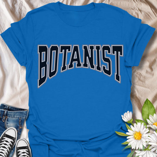 Bold collegiate-style "Botanist" t-shirt perfect for plant lovers, gardeners, horticulture enthusiasts, and nature fans. Great gift for botanists, science teachers, plant nerds, and anyone passionate about flora and botany. Clean minimalist typography design.