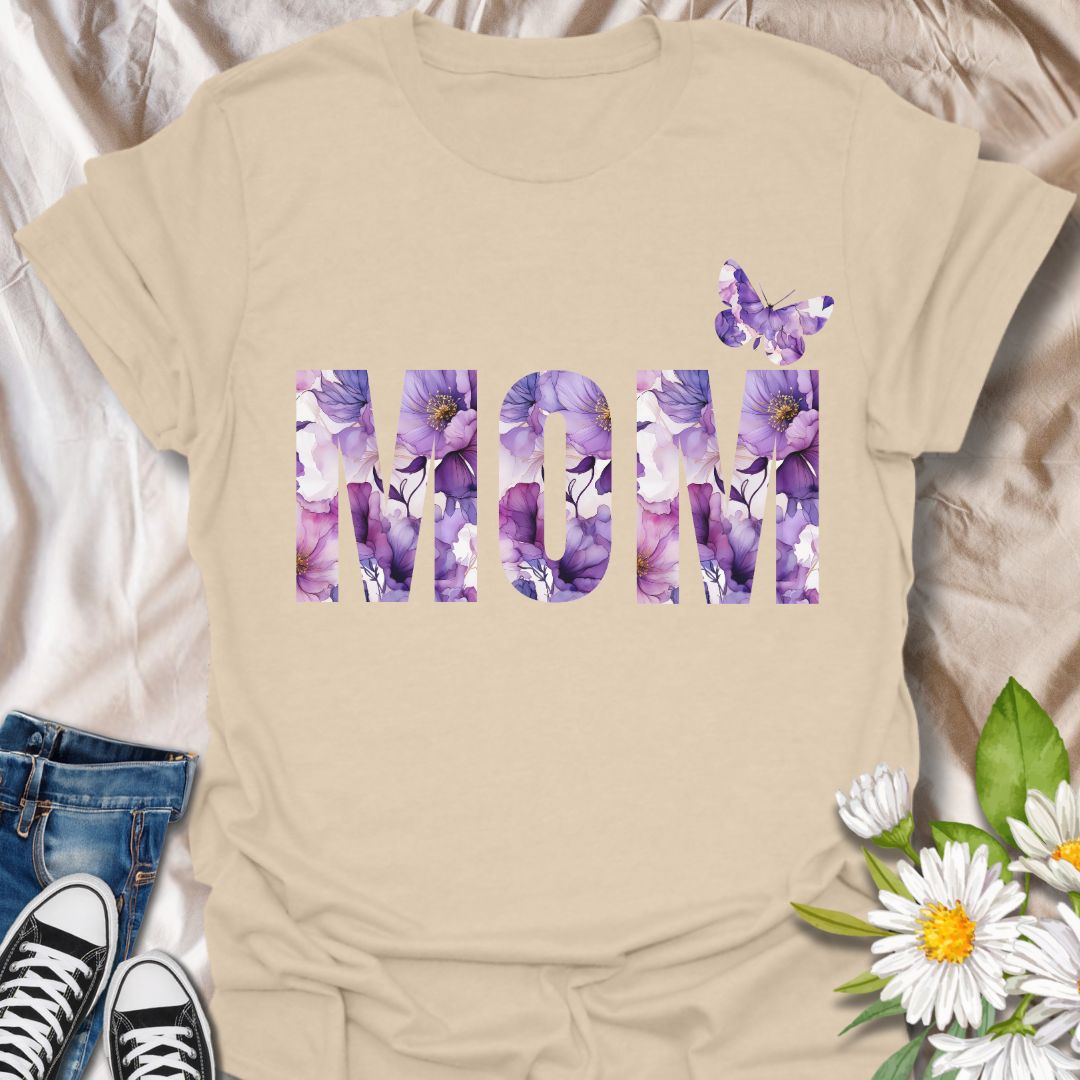 Beautiful floral “MOM” t-shirt with elegant purple and pink watercolor blooms and a butterfly accent. Perfect Mother's Day gift or everyday wear for plant moms, flower lovers, and garden enthusiasts. Celebrate motherhood with botanical charm.