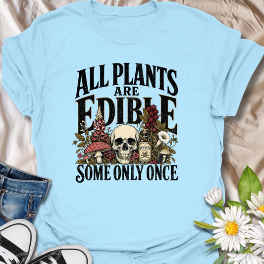 All Plants Are Edible t-shirt for plant lovers with a dark sense of humor and a love for botanical warnings.
The bold vintage-style design features mushrooms, plants, and skull artwork for a funny garden-meets-goth look.
It is perfect for gardeners, houseplant fans, mushroom lovers, and anyone who appreciates slightly twisted plant humor.
A fun gift for plant people who know some greenery should definitely be admired, not tasted.