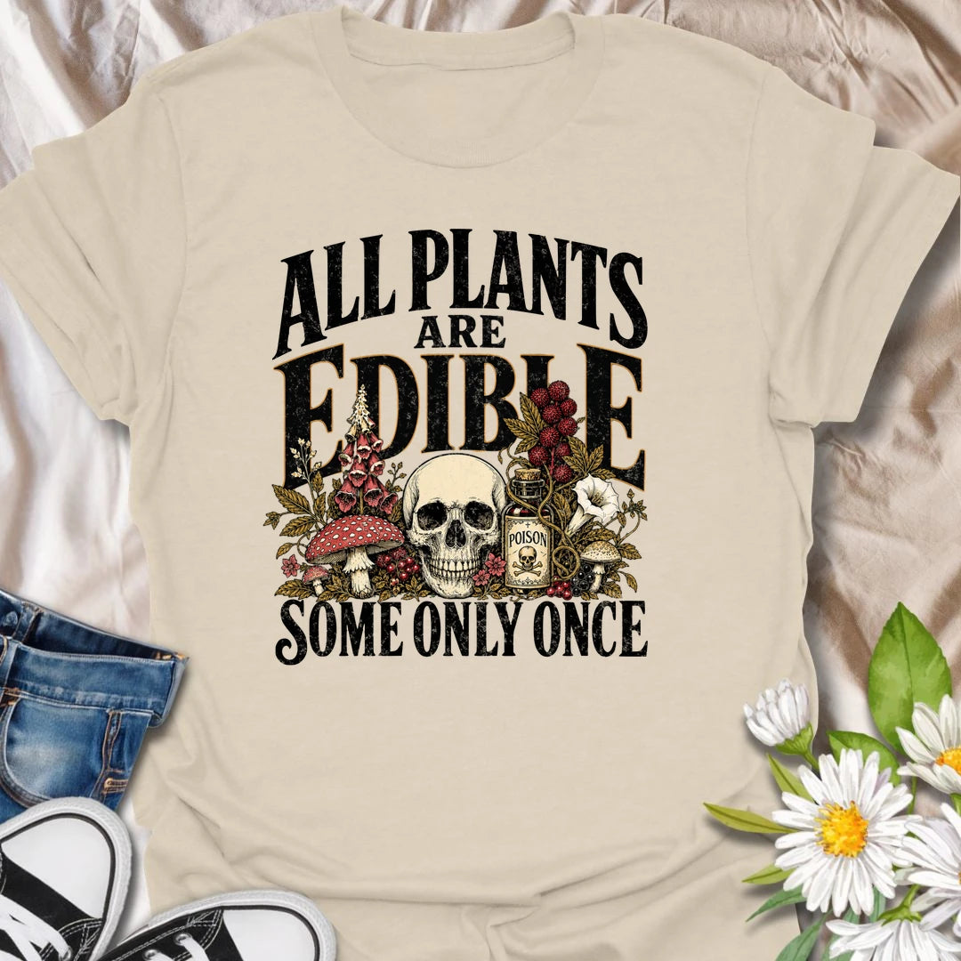 All Plants Are Edible t-shirt for plant lovers with a dark sense of humor and a love for botanical warnings.
The bold vintage-style design features mushrooms, plants, and skull artwork for a funny garden-meets-goth look.
It is perfect for gardeners, houseplant fans, mushroom lovers, and anyone who appreciates slightly twisted plant humor.
A fun gift for plant people who know some greenery should definitely be admired, not tasted.