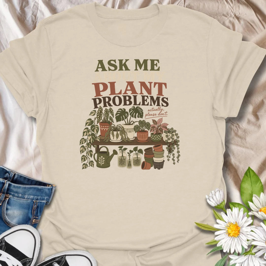 Invite a very long conversation with this “Ask Me About My Plant Problems” T-shirt. Featuring a collection of thriving, trailing, and slightly dramatic houseplants, it is ideal for plant parents who always have a care story to share. A funny botanical gift for houseplant collectors and indoor gardeners.