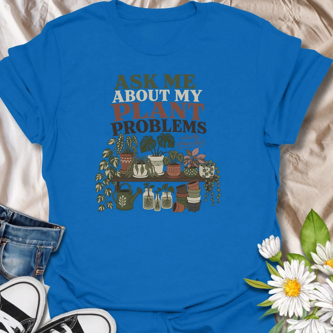 Invite a very long conversation with this “Ask Me About My Plant Problems” T-shirt. Featuring a collection of thriving, trailing, and slightly dramatic houseplants, it is ideal for plant parents who always have a care story to share. A funny botanical gift for houseplant collectors and indoor gardeners.