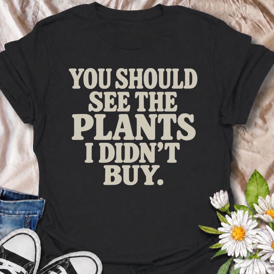 A funny plant T-shirt for anyone whose restraint deserves at least a little recognition. The phrase “You Should See the Plants I Didn’t Buy” delivers dry, self-aware humor that plant parents, nursery regulars, and houseplant collectors will instantly understand. Its bold retro typography keeps the design simple, readable, and easy to wear. It makes a great gift for plant lovers who somehow manage to leave the garden center with fewer plants than they wanted. Perfect for nursery trips, plant swaps, casual we