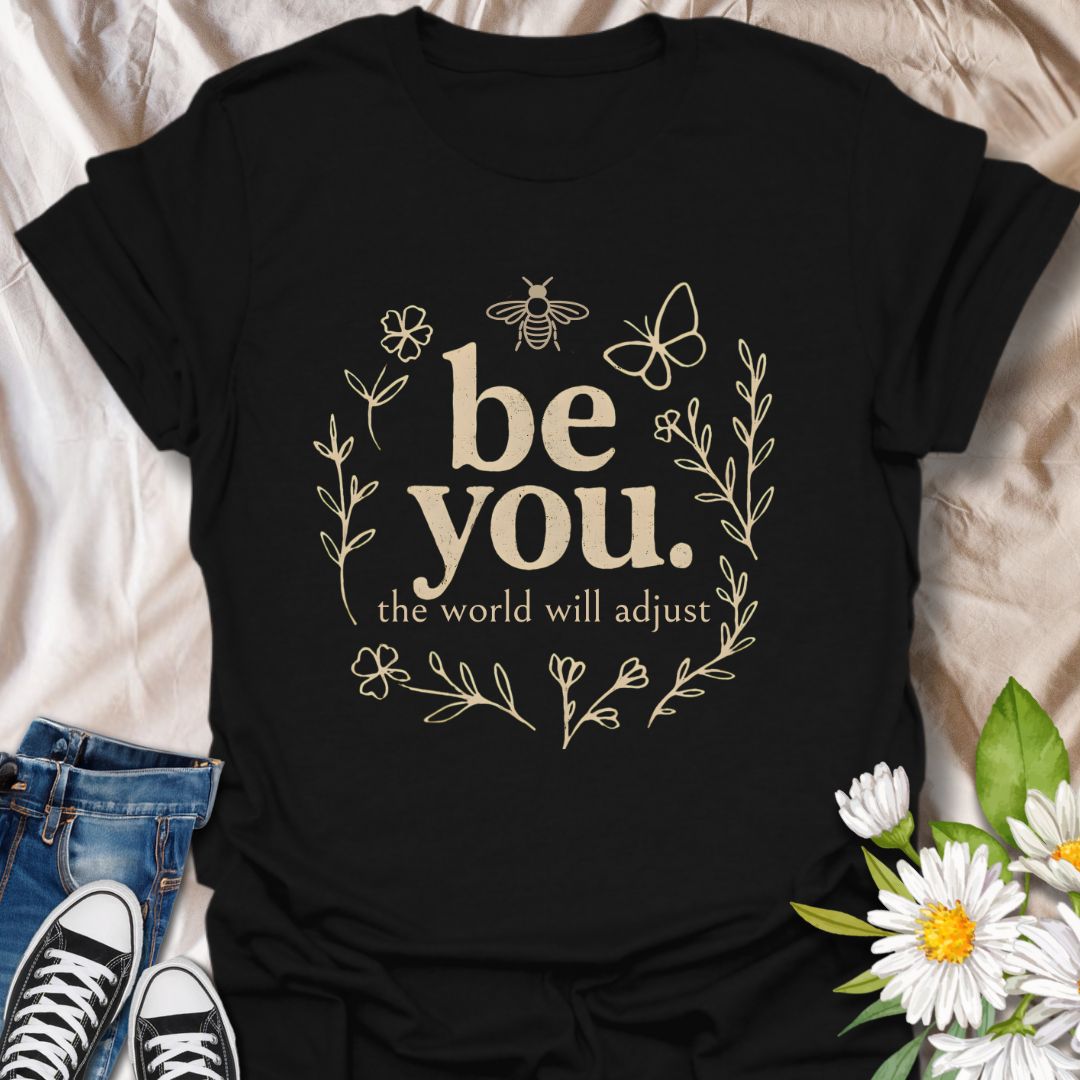 Empower your individuality with this inspiring “be you, the world will adjust” t-shirt design. Featuring whimsical floral and nature-themed elements like bees and butterflies, this uplifting graphic tee promotes self-love, confidence, and authenticity — ideal for free spirits and positivity lovers.
