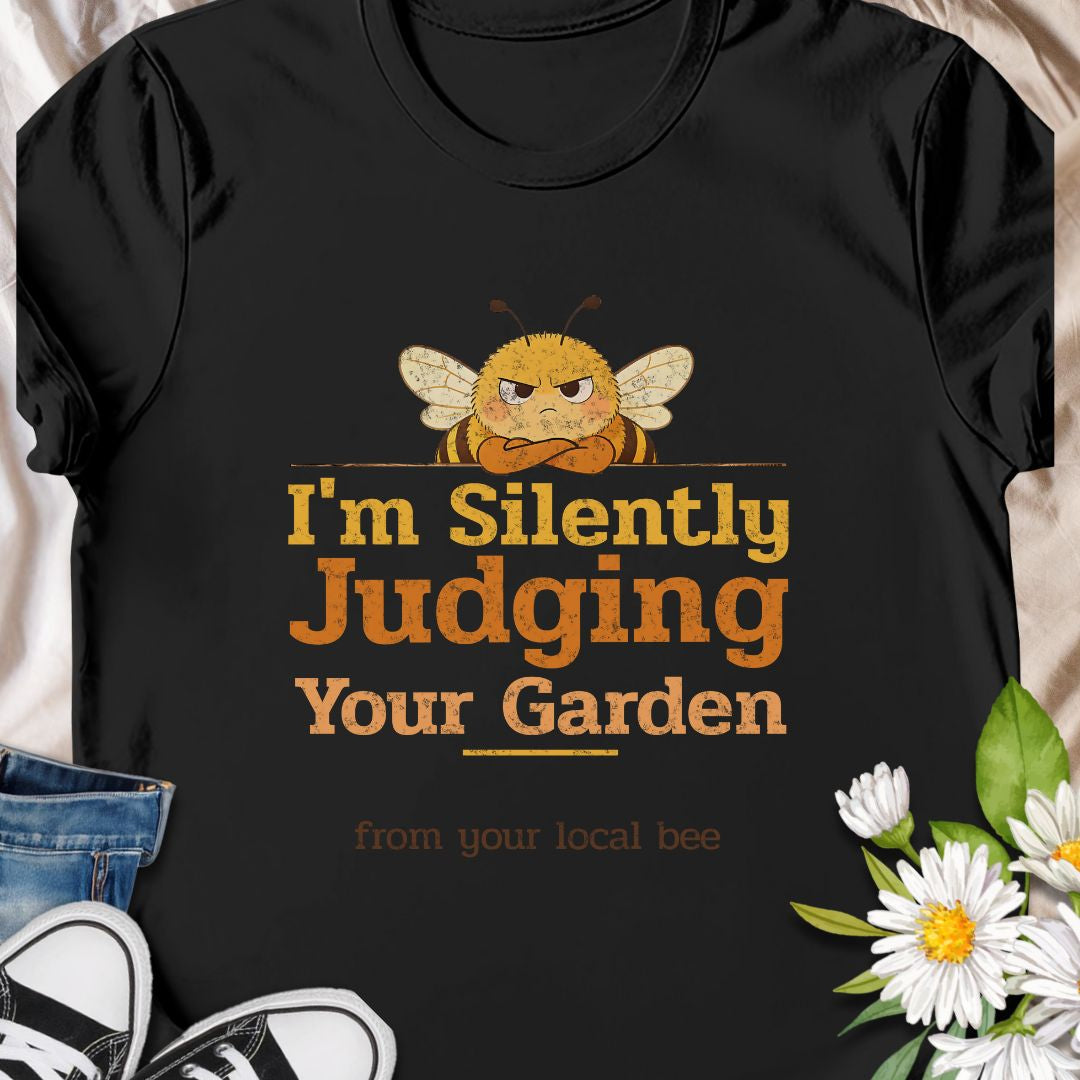 Let your inner bee do the talking with this hilarious “I’m Silently Judging Your Garden” T-shirt featuring a grumpy bee. Perfect for gardeners, plant lovers, and pollinator protectors with a sarcastic sense of humor. A playful gift for bee enthusiasts and backyard botanists alike.