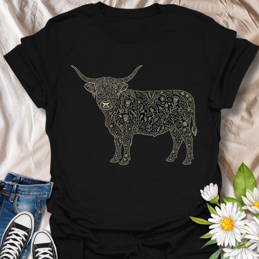 Show off your love for rustic charm and artistic nature with this intricately designed Highland cow graphic t-shirt. Featuring a beautifully detailed floral pattern within the iconic silhouette of a Highland cow, this design is perfect for farm lovers, botanical art fans, and anyone who appreciates country-inspired fashion with a creative twist.