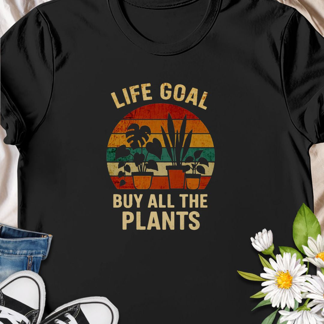 Set your priorities straight with this vintage-style “Life Goal: Buy All The Plants” tee! Featuring a colorful retro design with potted plants, it's the perfect shirt for proud plant collectors, indoor jungle creators, and every crazy plant person. A must-have for plant moms and dads!