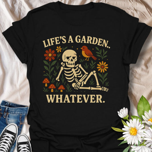Embrace laid-back humor with this whimsical skeleton garden t-shirt featuring playful mushrooms, flowers, and a bird alongside the sarcastic quote "Life’s a Garden.. Whatever." Perfect for lovers of dark humor, casual goth style, and quirky nature-themed apparel.