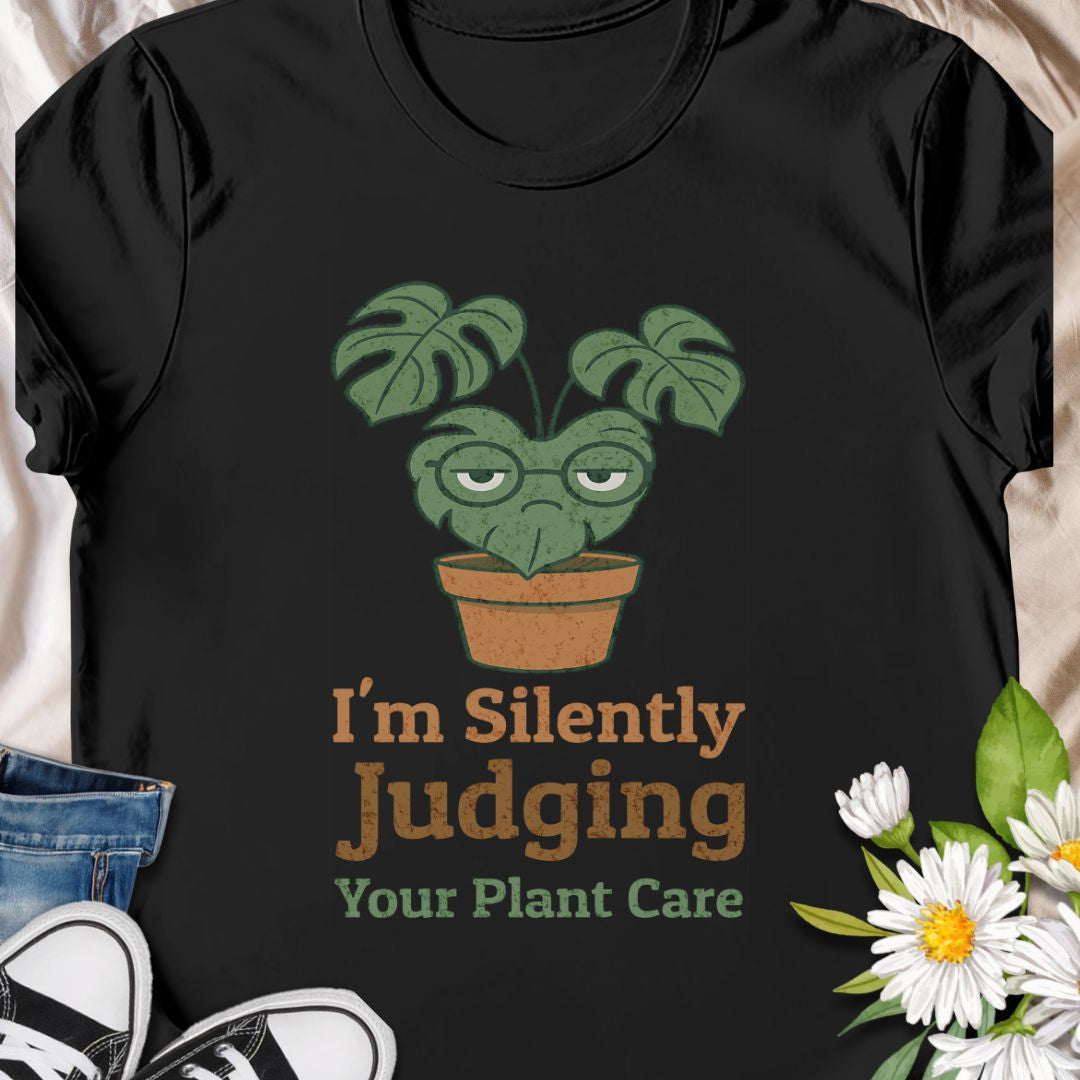 Calling all sassy plant parents – this “I'm Silently Judging Your Plant Care” tee is made for you! Featuring a moody monstera in a pot, it’s perfect for green thumbs who have high standards and a sense of humor. Ideal gift for plant moms, plant dads, and houseplant snobs alike!