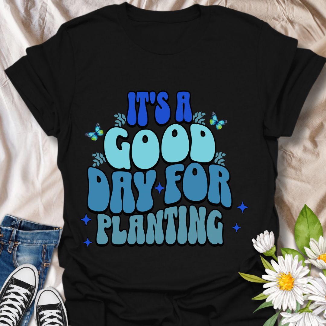 Bright and cheerful "It's a Good Day for Planting" t-shirt featuring retro-style typography with playful butterflies and vibrant blue tones. Perfect for gardeners, plant lovers, and anyone who finds joy in planting flowers and tending to nature. This planting t-shirt is an Ideal gardening gift, outdoor hobby shirt, botanical fashion, nature lover apparel, and springtime outfit.  