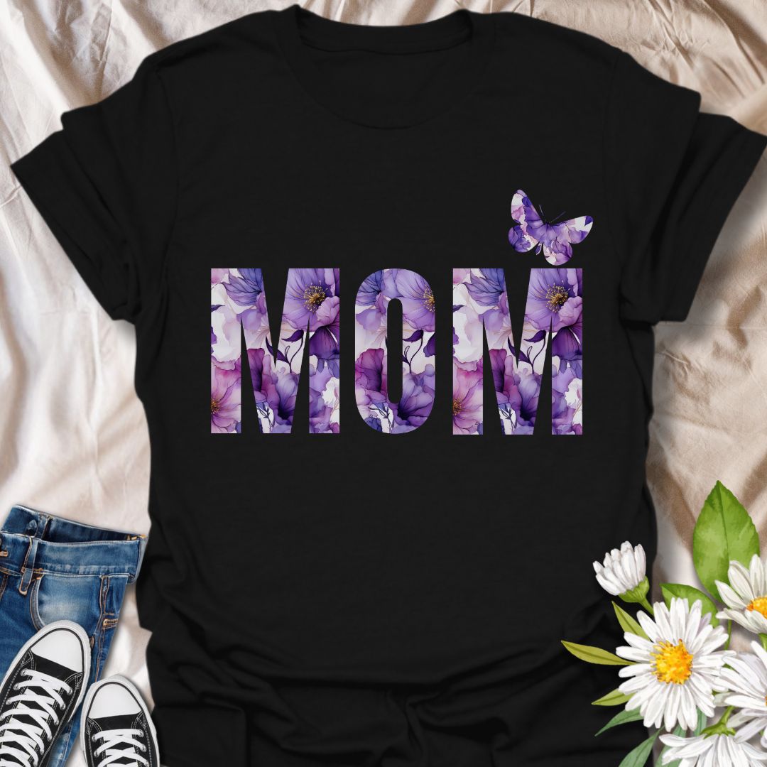 Beautiful floral “MOM” t-shirt with elegant purple and pink watercolor blooms and a butterfly accent. Perfect Mother's Day gift or everyday wear for plant moms, flower lovers, and garden enthusiasts. Celebrate motherhood with botanical charm.