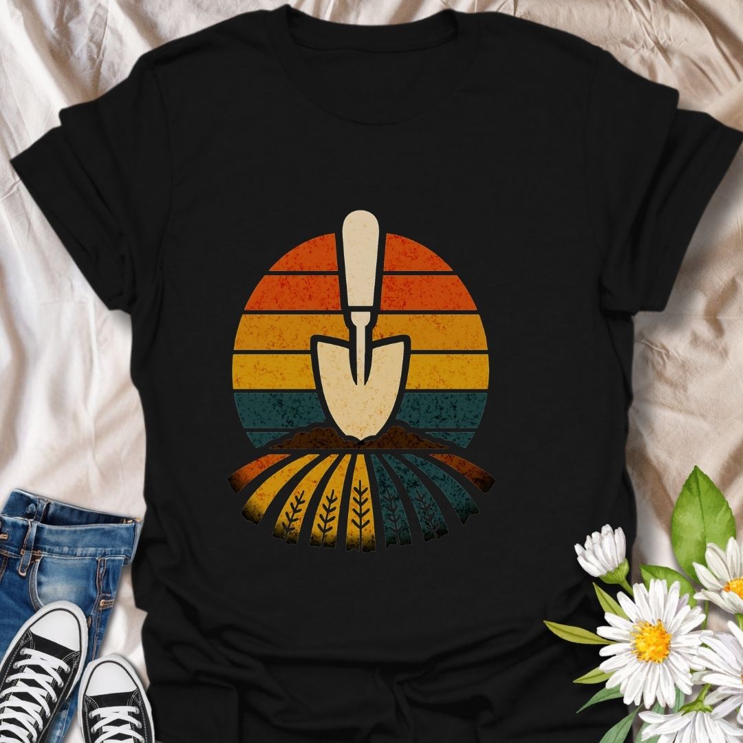 Retro gardening t-shirt featuring a vintage-style trowel and sunset field design. Perfect gift for gardeners, farmers, and nature lovers. Bold and earthy outdoor wear.