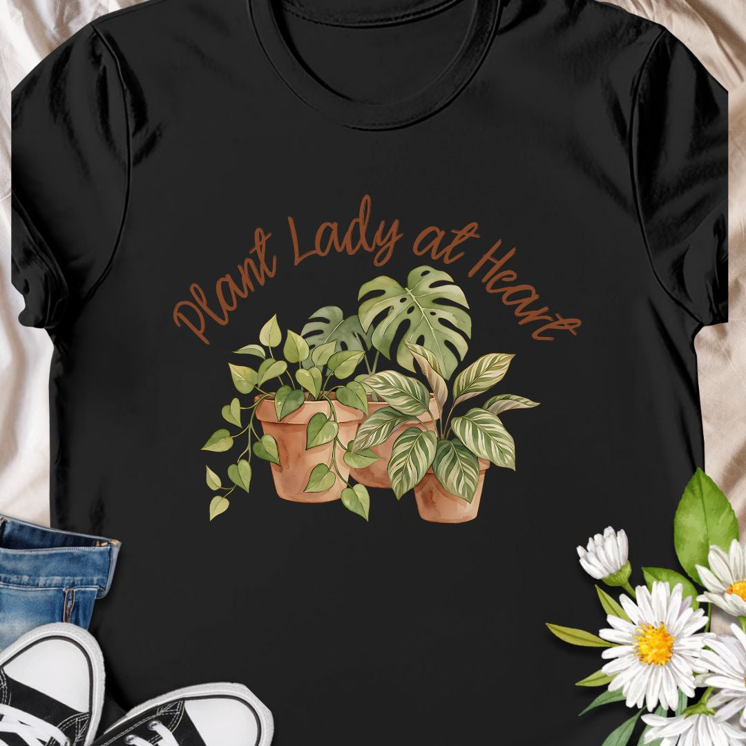 Celebrate your love for greenery with this charming “Plant Lady at Heart” t-shirt. Featuring soft water color-style potted plants and elegant script text, it’s the perfect gift for plant moms, gardeners, and nature enthusiasts. Wear it proudly and show the world that your heart truly belongs to plants—comfort meets style in this must-have tee.