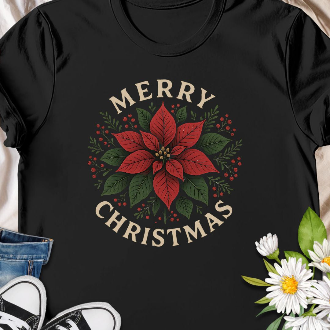 Botanical tee that carries a quietly festive spirit — a poinsettia framed by warm "Merry Christmas" lettering.  Subtle vintage tones in the print give the design a homey, handmade feel that blends with cozy kitchens, neighborhood caroling, and quiet evenings by twinkling lights. Wear it while wrapping gifts, making cocoa, or hosting a laid-back family dinner.