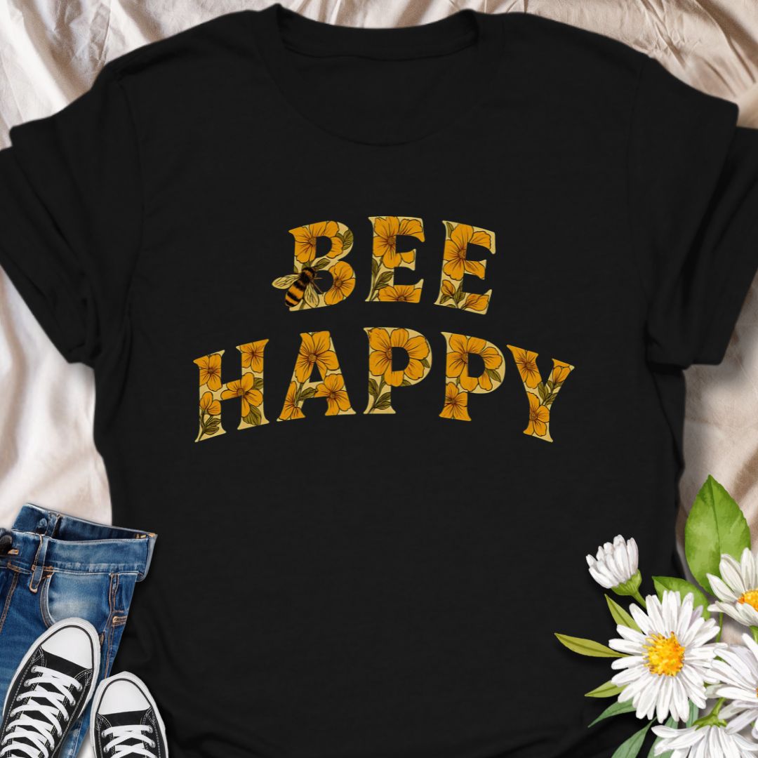 Spread positivity and nature-loving vibes with this charming “Bee Happy” t-shirt, featuring sunflower-filled typography and a playful bee motif. Perfect for beekeepers, garden lovers, and anyone who appreciates cheerful, nature-inspired fashion. A great gift for pollinator advocates and flower enthusiasts.