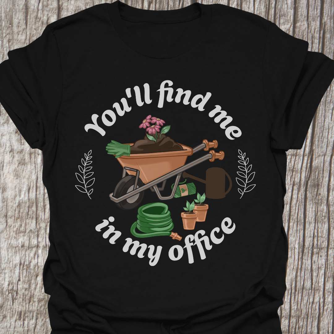 circular text 'You'll find me in my office' with wheelbarrow, hose, plants and watering can within circle all text in white on black  t-shirt
