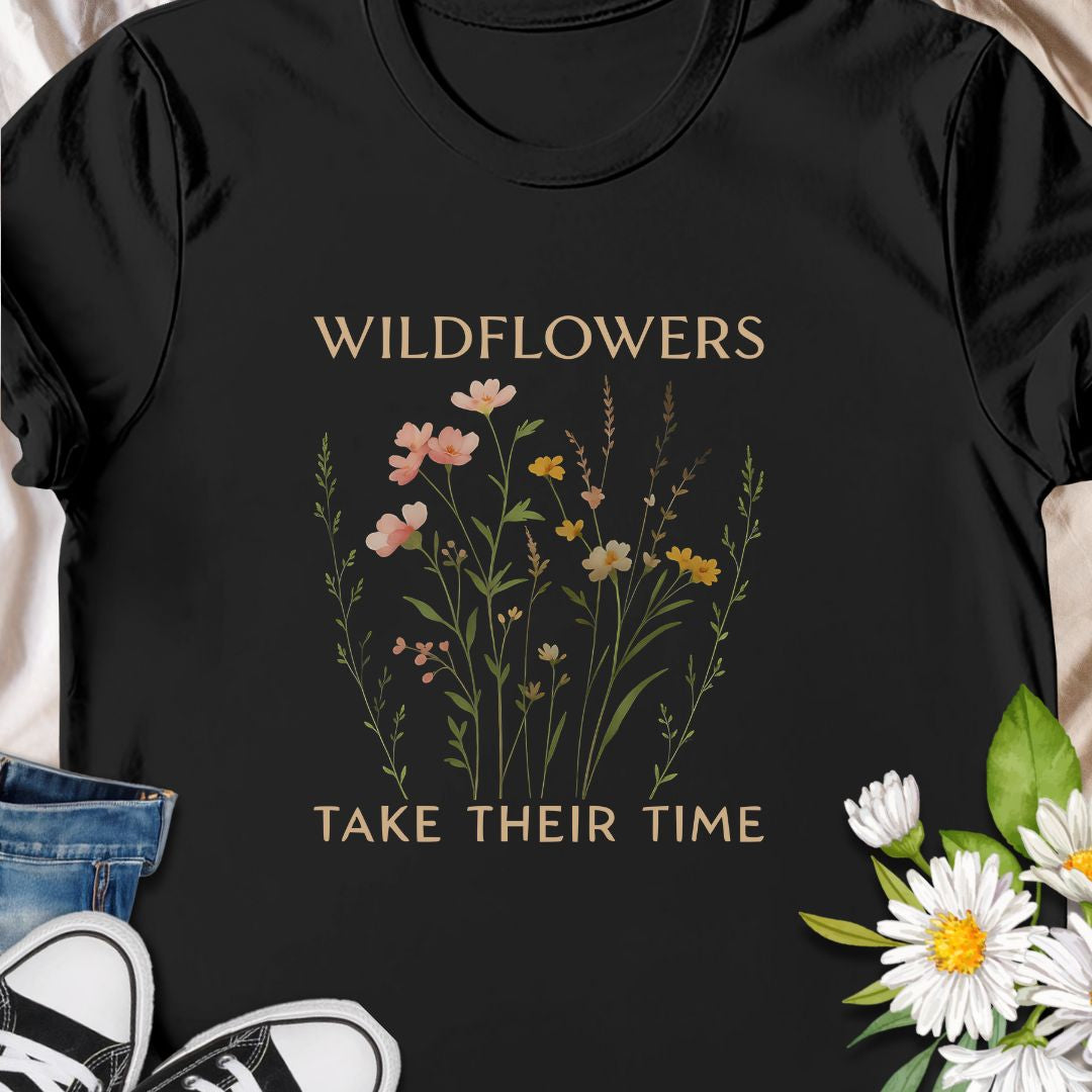 Inspirational wildflower tee featuring soft meadow flowers and motivational quote. A calming nature-themed shirt.