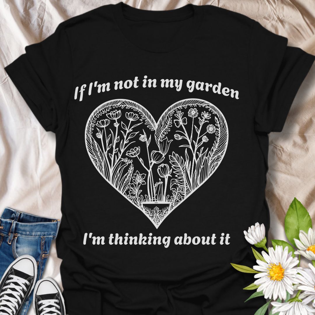 Show off your gardening passion with this beautifully illustrated heart-shaped floral design. Featuring the phrase “If I'm not in my garden, I'm thinking about it,” this shirt is perfect for plant lovers who dream of dirt, blooms, and backyard bliss.