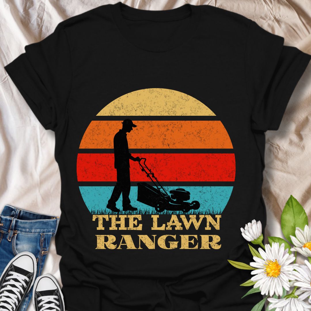 Hilarious retro-style t-shirt with a sunset silhouette of a man mowing the lawn and the phrase “The Lawn Ranger.” Perfect for dads, garden enthusiasts, or anyone who takes mowing seriously (or not!). Great gift for Father's Day or yard work pros.  Black