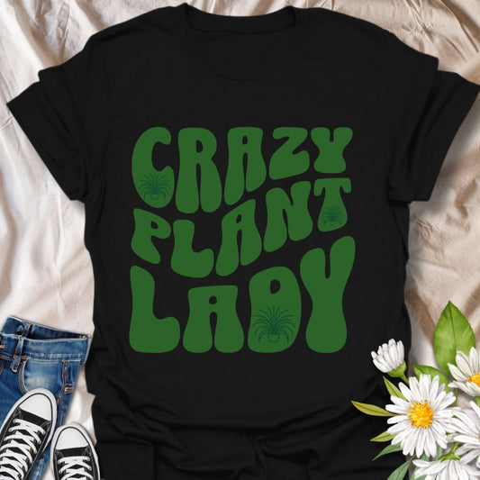 Bold retro "Crazy Plant Lady" t-shirt with funky green typography. Perfect for plant moms, houseplant addicts, and garden lovers who proudly embrace their love for plants. A fun botanical graphic tee and great gift for plant enthusiasts.
