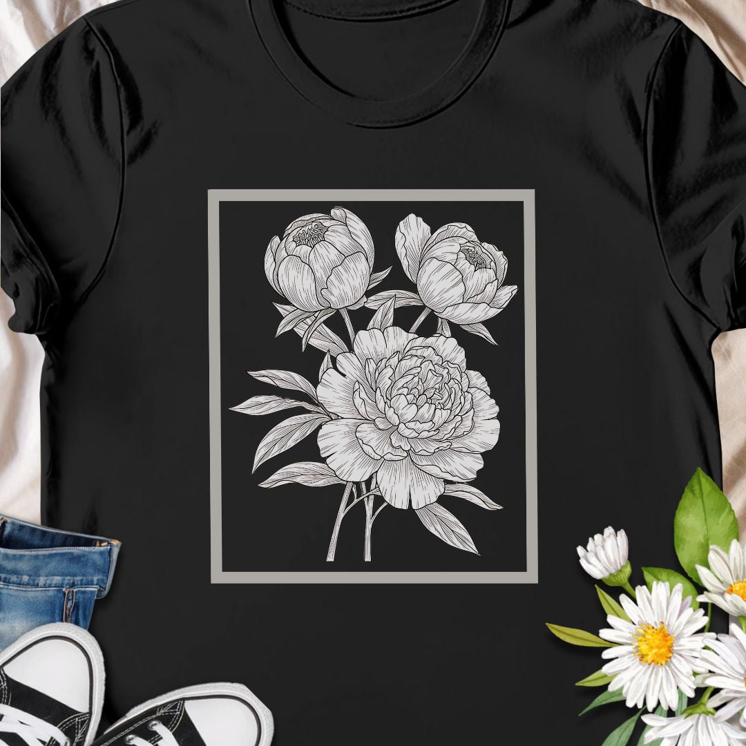 Elegant floral sketch tee featuring detailed peony artwork. Perfect for garden lovers and botanical art fans.  The clean, framed floral sits centered on the chest in fine-line detail — subtle enough to layer under a jacket, expressive enough to stand on its own.
