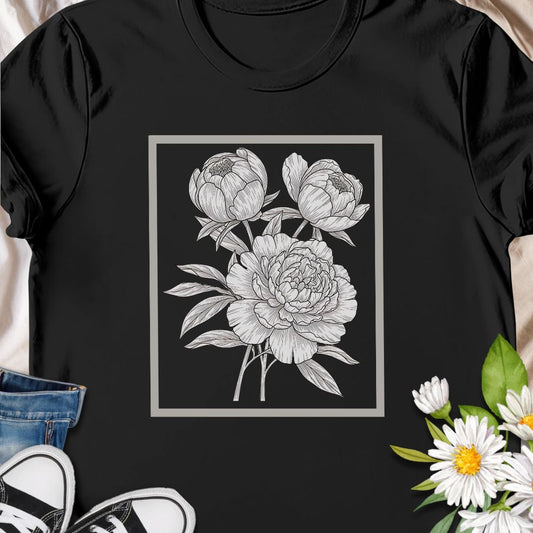 Elegant floral sketch tee featuring detailed peony artwork. Perfect for garden lovers and botanical art fans.  The clean, framed floral sits centered on the chest in fine-line detail — subtle enough to layer under a jacket, expressive enough to stand on its own.