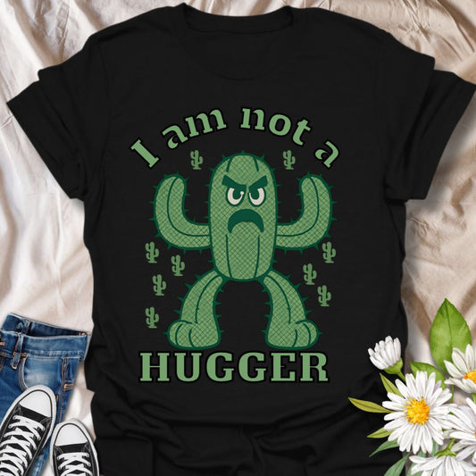 Funny cactus t-shirt with angry cartoon cactus character and bold 'I Am Not a Hugger' text. Perfect humorous gift for plant lovers, introverts, and anyone with a sharp sense of humor.