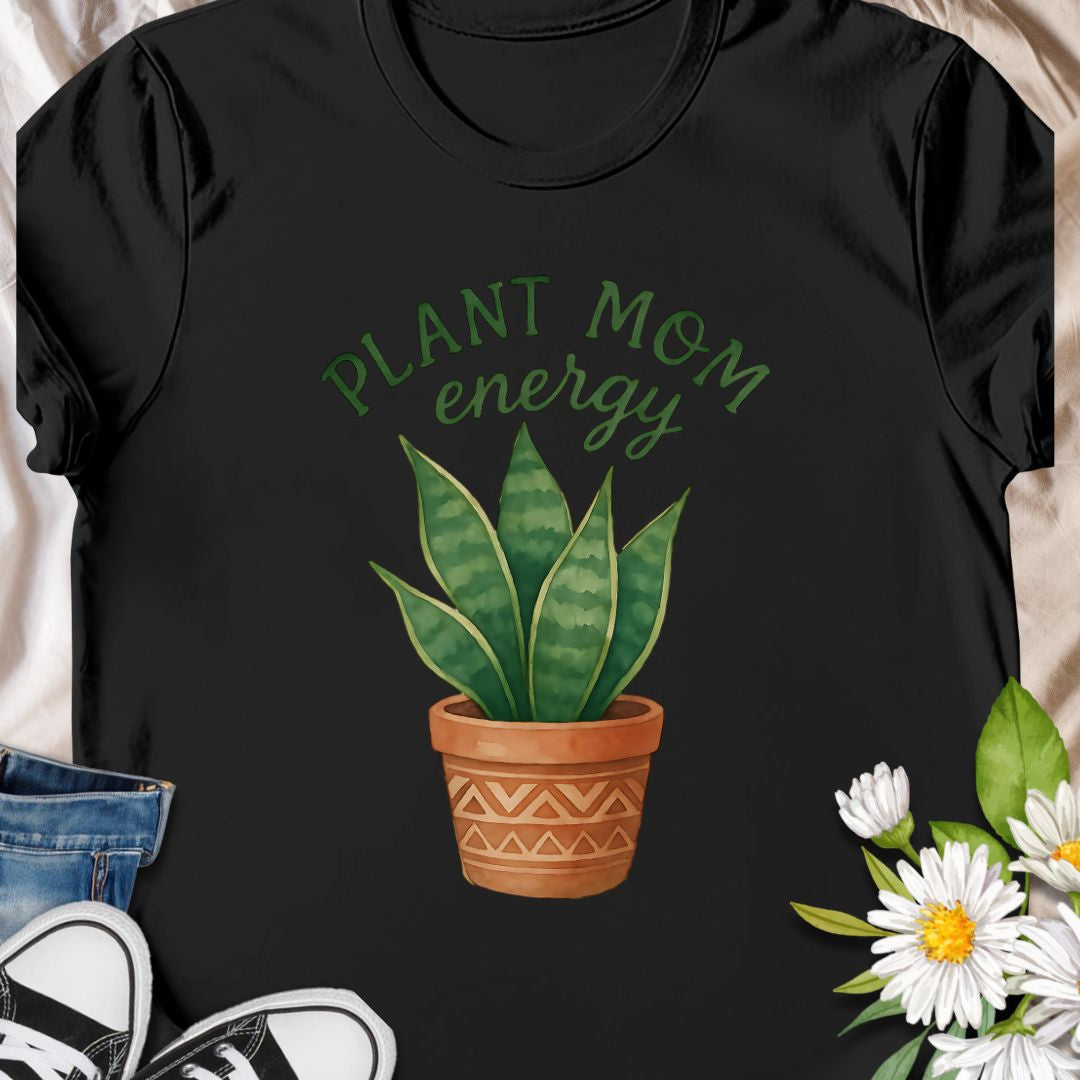 Show off your green thumb with this stylish “Plant Mom Energy” t-shirt featuring a beautiful snake plant in a terracotta pot. Perfect for indoor gardeners and houseplant lovers, this tee radiates nurturing vibes and earthy style. A cozy, cute wardrobe essential for any proud plant mom!