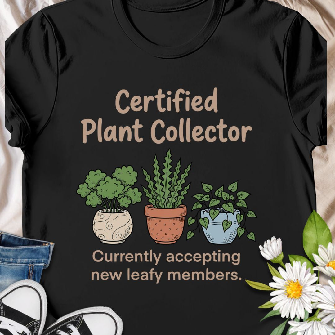 Show off your green thumb with this “Certified Plant Collector” t-shirt featuring charming potted plants and the phrase “Currently accepting new leafy members.” Perfect for plant parents, indoor jungle enthusiasts, or anyone who can’t resist bringing home another plant. A cozy and fun gift for birthdays or plant swaps.