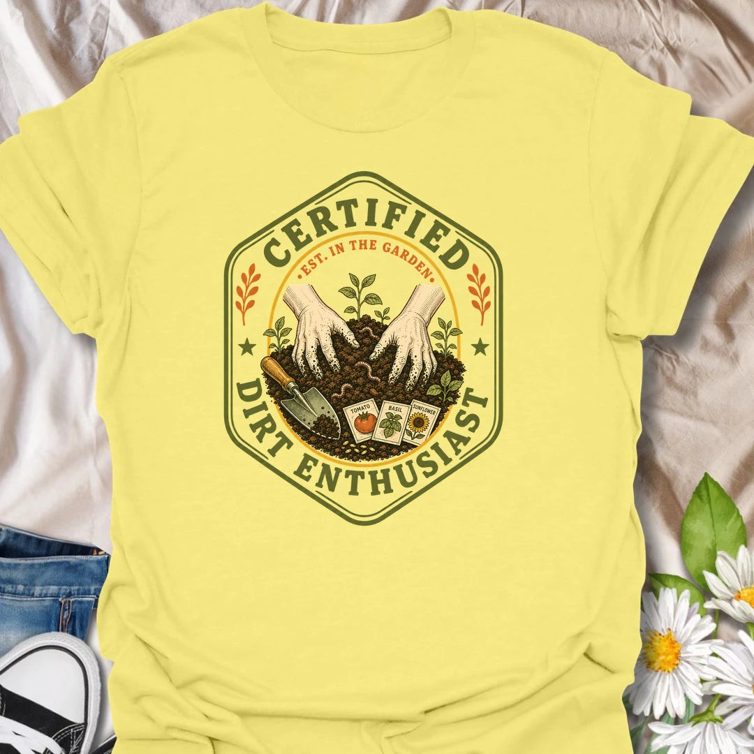 This Certified Dirt Enthusiast t-shirt is made for gardeners who are happiest with their hands in the soil and seedlings ready to grow. Featuring a vintage badge-style design with gloved hands, rich garden dirt, seed packets, tools, and fresh sprouts, this tee has a classic gardening-club feel with plenty of earthy personality. Perfect for gardeners, plant lovers, backyard growers, vegetable gardeners, flower fans, and anyone who proudly loves dirt, seeds, and garden time.