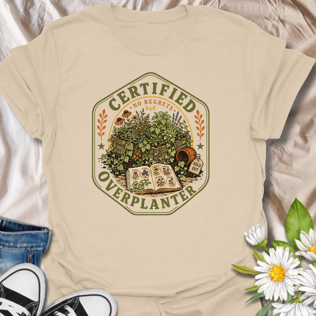 This Certified Overplanter t-shirt is made for gardeners who know there is always room for just one more seedling, even when the garden is already overflowing. Featuring a vintage badge-style design with crowded garden beds, seed packets, an open seed catalog, a sold out pot, and the phrase No Regrets, this tee has a funny plant-lover feel with classic garden-club charm. Perfect for gardeners, plant lovers, backyard growers, flower fans, vegetable gardeners, and anyone who proudly overplants every season.