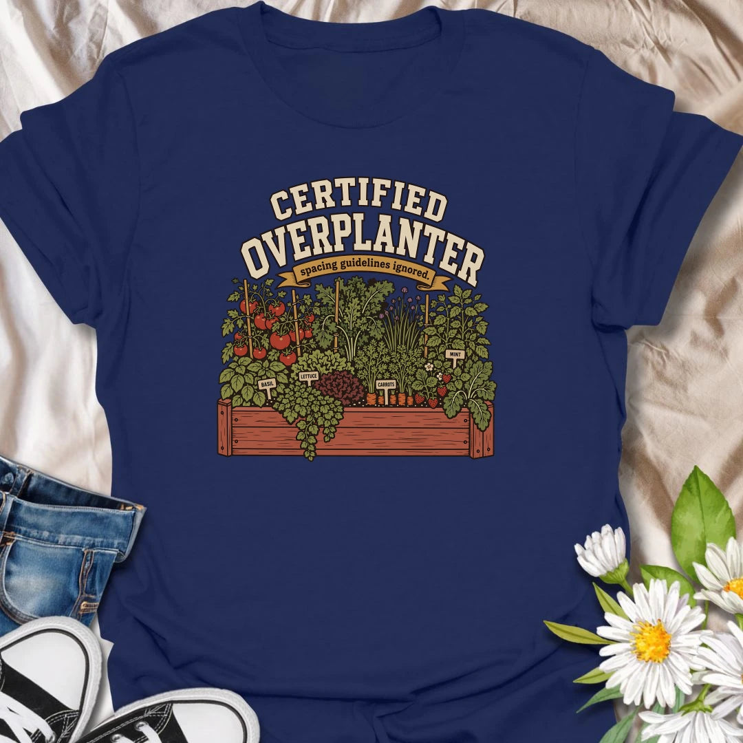 Celebrate an overflowing vegetable garden with this “Certified Overplanter” T-shirt. The detailed raised-bed design features tomatoes, carrots, lettuce, basil, mint, strawberries, and the perfect lack of spacing. It is a funny gift for ambitious gardeners who always squeeze in one more plant.