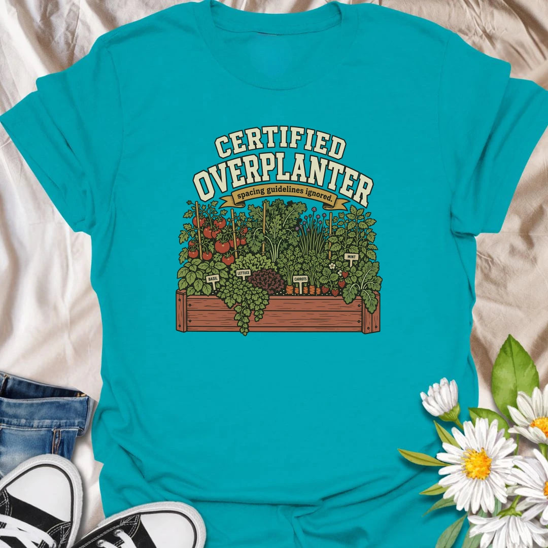Celebrate an overflowing vegetable garden with this “Certified Overplanter” T-shirt. The detailed raised-bed design features tomatoes, carrots, lettuce, basil, mint, strawberries, and the perfect lack of spacing. It is a funny gift for ambitious gardeners who always squeeze in one more plant.
